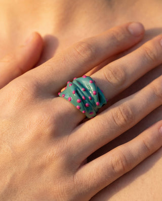 Efemera Wild Flower ring - teal enamel with pink dots on model