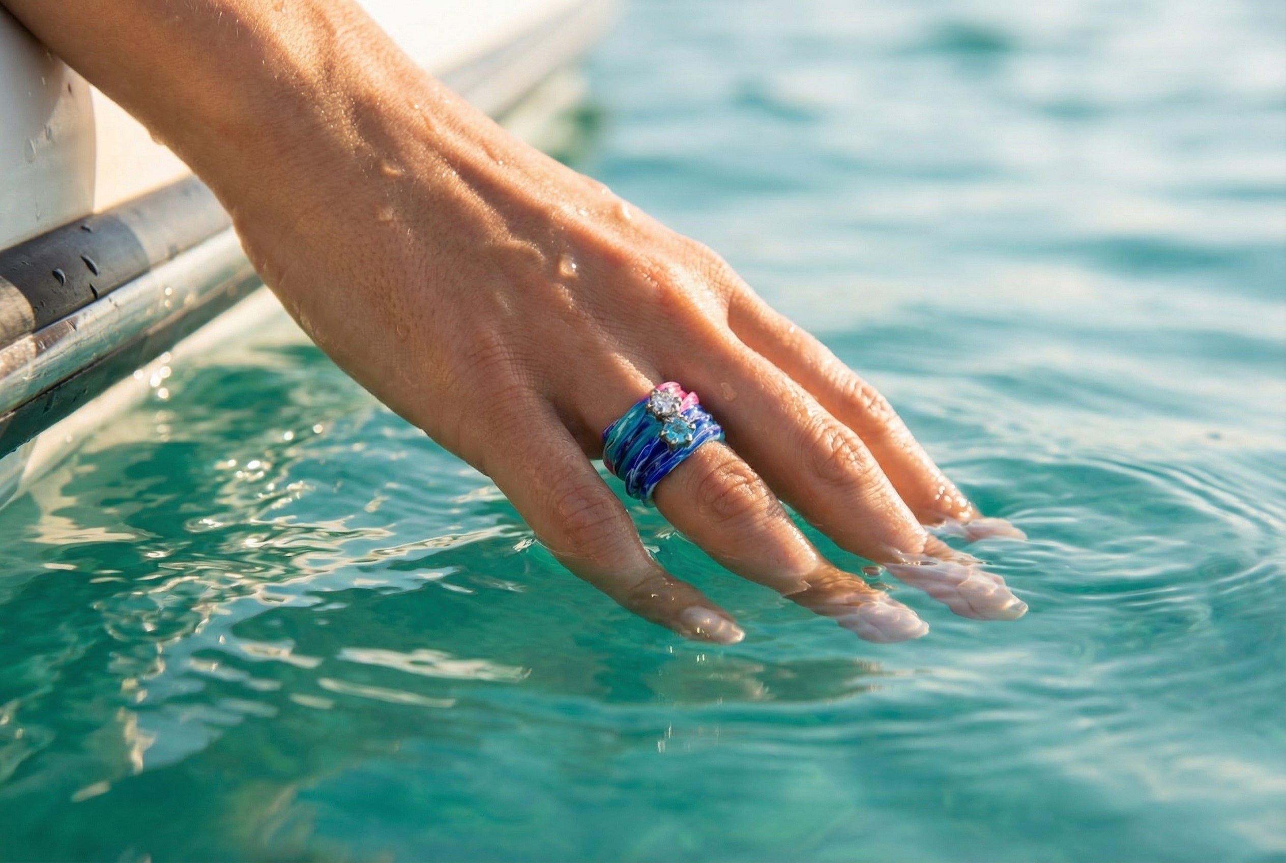 Efemera Aqua Dream ring - blue teal marble swirl with crystals - hand in water